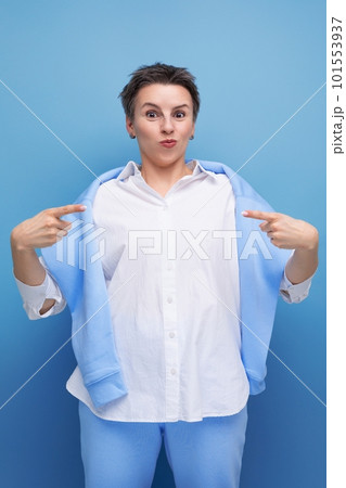 portrait of charismatic young millennial woman with short haircut pointing finger 101553937