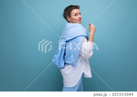 portrait of a cheerful young woman with a short haircut in a stylish casual look portrait of a cheerful young woman with a short haircut in a stylish casual look 101553994