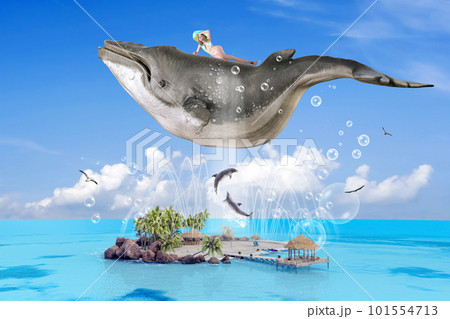 真夏の海に浮かぶ孤島の上を鯨に乗って飛んでいる水着の美女 101554713