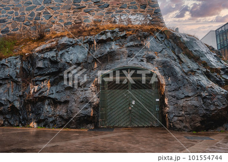 Gates to the bunker inside the cliff. Nuclear shelter. Gates to the bunker inside the cliff. Nuclear shelter. 101554744