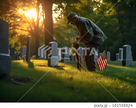 A man kneeling down next to a flag in a cemetery on Memorial Day. AI generative image A man kneeling down next to a flag in a cemetery on Memorial Day. AI generative image 101556024
