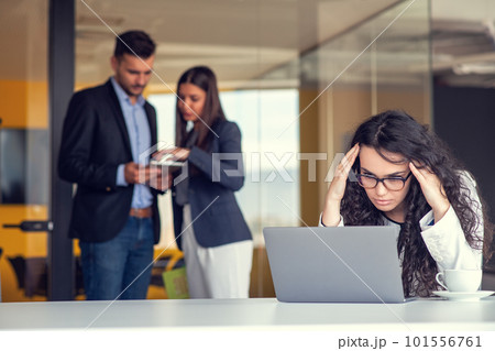 Team work discussing. Young woman with paper folder. 101556761