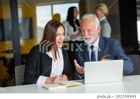 Mature businessman leader mentor talking to diverse colleagues team listening to caucasian ceo. Mature businessman leader mentor talking to diverse colleagues team listening to caucasian ceo. 101556943