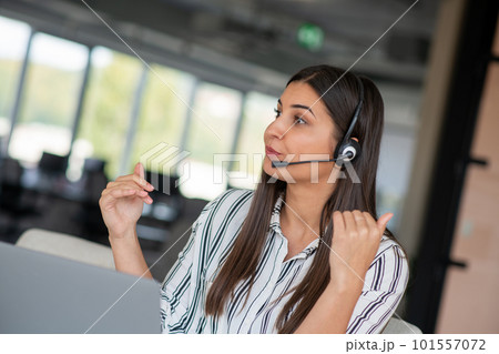 Brunette Lady Video Calling On Laptop Wearing Headphones Smiling And Waving Hand To Webcam Communicating Online Brunette Lady Video Calling On Laptop Wearing Headphones Smiling And Waving Hand To Webcam Communicating Online 101557072