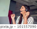 Young friendly operator woman agent with headsets working in a call centre. 101557090