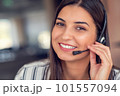 Young friendly operator woman agent with headsets working in a call centre. 101557094