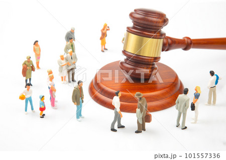 Miniature people. Many people near the gavel of law and justice 101557336
