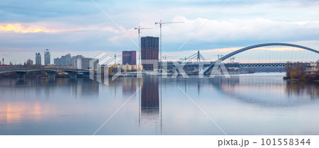 bridge across a large river in a modern city. industrial city infrastructure bridge across a large river in a modern city. industrial city infrastructure 101558344