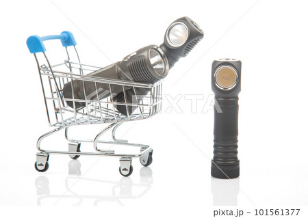 different flashlight in a grocery basket on a white background different flashlight in a grocery basket on a white background 101561377