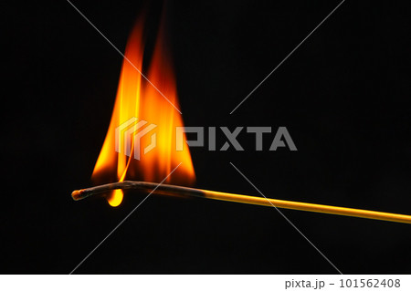 Burning wood match on a dark background close-up. burning tree fire Burning wood match on a dark background close-up. burning tree fire 101562408