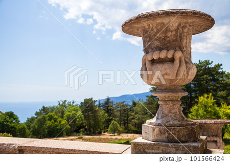 Decorative old stone vase in a garden on a sunny day. Crimea Decorative old stone vase in a garden on a sunny day. Crimea 101566424