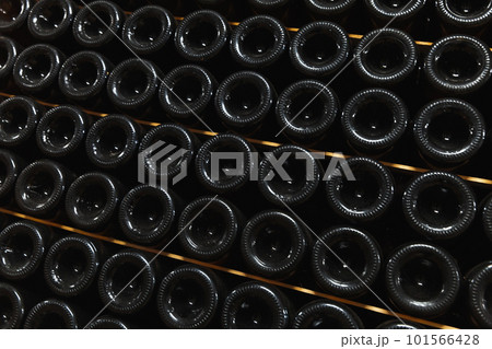 Stacked bottles of wine lay in a wine Vault Stacked bottles of wine lay in a wine Vault 101566428