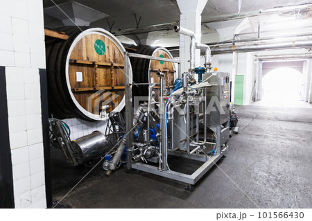 Old oak barrels and equipment of winery 101566430