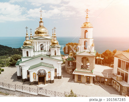 Christian church in the mountains above the sea. Temple of the Holy Archangel Michael in Oreanda. The southern coast of Crimea. Aerial view Christian church in the mountains above the sea. Temple of the Holy Archangel Michael in Oreanda. The southern coast of Crimea. Aerial view 101567285