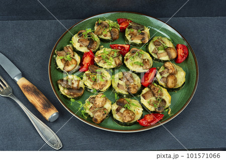 Baked zucchini with mushrooms Baked zucchini with mushrooms 101571066