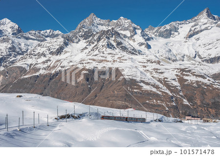 The train of Gonergratbahn running to the Gornergrat station and Stellarium Observatory - famous touristic place with clear view to Matterhorn. Glacier Express train. 101571478