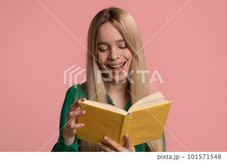 Woman reading funny interesting fairytale story book, leisure hobby knowledge wisdom learning, study Woman reading funny interesting fairytale story book, leisure hobby knowledge wisdom learning, study 101571548