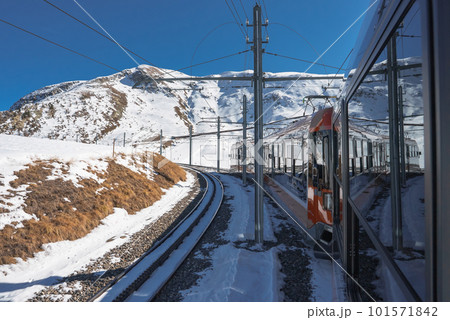 The train of Gonergratbahn running to the Gornergrat station and Stellarium Observatory - famous touristic place with clear view to Matterhorn. Glacier Express train. 101571842