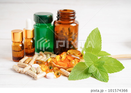 Alternative medicine herbal organic capsule with vitamin E omega 3 fish oil, mineral, drug with herbs leaf natural supplements for healthy good life. Alternative medicine herbal organic capsule with vitamin E omega 3 fish oil, mineral, drug with herbs leaf natural supplements for healthy good life. 101574366