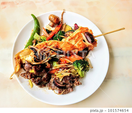 Asian dish with chicken and vegetables, top view. High quality photo Asian dish with chicken and vegetables, top view. High quality photo 101574654