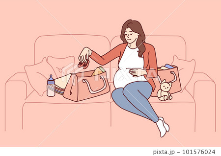 Pregnant woman is packing things for unborn child in bag going to maternity hospital Pregnant woman is packing things for unborn child in bag going to maternity hospital 101576024