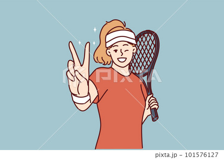 Woman tennis player demonstrates victory gesture before tournament or championship 101576127