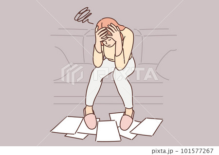 Woman frustrated with financial problems, sits with head bowed over papers scattered on floor Woman frustrated with financial problems, sits with head bowed over papers scattered on floor 101577267