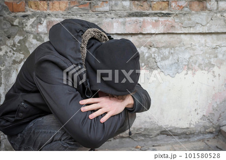 A person is an addict experiencing a drug addiction crisis after prolonged drug use. A person is an addict experiencing a drug addiction crisis after prolonged drug use. 101580528