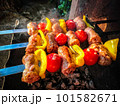 Shish kebab with sausages, peppers and tomatoes italian style, on grill 101582671