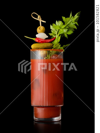 Bloody mary cocktail with stick and various snack on black.Olive,pepper,onion,celery,pickle Bloody mary cocktail with stick and various snack on black.Olive,pepper,onion,celery,pickle 101582821