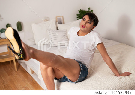 Gay trying on high heels. The guy with makeup. 101582935