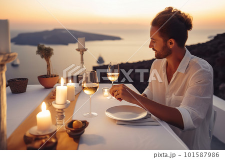 A man sitting at a table with two glasses of wine. AI generative image A man sitting at a table with two glasses of wine. AI generative image 101587986