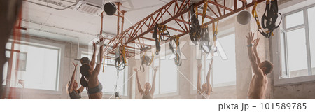 Team of sporty people training in fitness club Team of sporty people training in fitness club 101589785