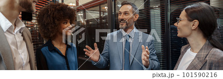 Multiethnic group of business people talking in office during break. Teamwork concept 101590216