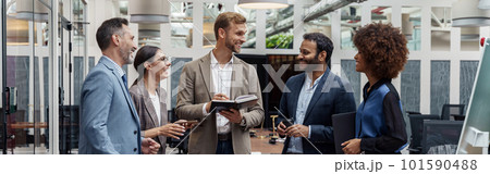 Multiethnic group of business people talking in office during break. Teamwork concept 101590488