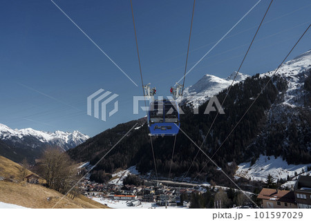 Cable car over landscape with mountains in background during winter vacation, winter holiday travel concept 101597029
