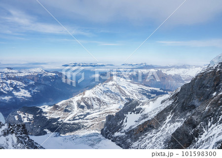 Magica view of the Alps mountains in Switzerland. View from helicopter in Swiss Alps. Mountain tops in snow. Breathtaking view of Jungfraujoch and the UNESCO World Heritage - the Aletsch Glacier Magica view of the Alps mountains in Switzerland. View from helicopter in Swiss Alps. Mountain tops in snow. Breathtaking view of Jungfraujoch and the UNESCO World Heritage - the Aletsch Glacier 101598300