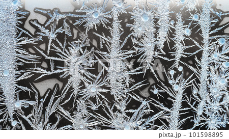 macro view of crystalline frost on window glass 101598895