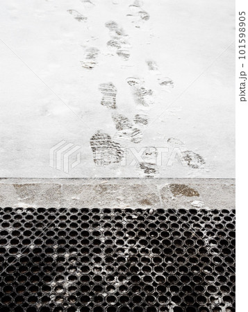 footprints on freshly fallen snow near porch 101598905