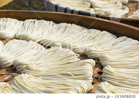 Close-up of traditional handmade noodle-making drying outdoors in Guanmiao, Tainan, Taiwan. Close-up of traditional handmade noodle-making drying outdoors in Guanmiao, Tainan, Taiwan. 101608830