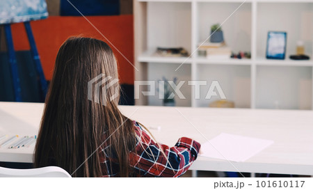 Art school. Kids painting. Artistic lesson. Little girl sitting table with ready for drawing light room interior back view. Art school. Kids painting. Artistic lesson. Little girl sitting table with ready for drawing light room interior back view. 101610117