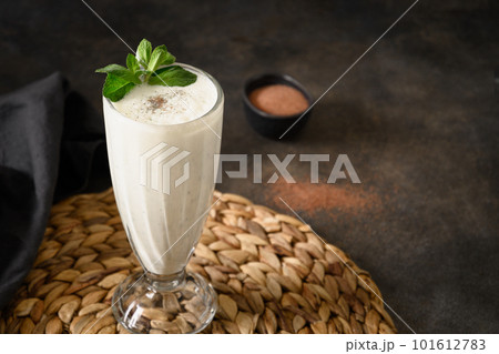 Indian Salty lassi with mint leaves and kala namak. 101612783