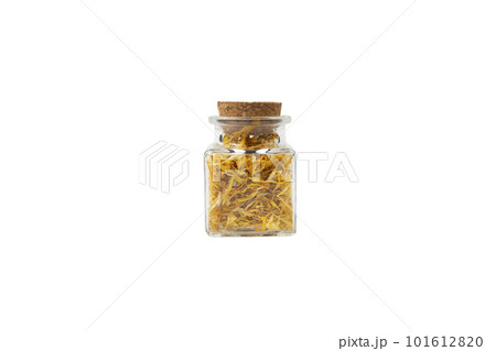 Dried Calendula or Marigold petals in a glass jar isolated on white background. 101612820