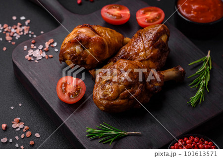 Delicious grilled chicken legs with spices and herbs in teriyaki sauce 101613571