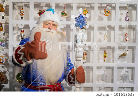 Russian Santa Claus chooses decorations for the Christmas tree in the store. Russian Santa Claus chooses decorations for the Christmas tree in the store. 101613638