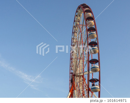 Ferris wheel against the sky. Amusement park on the sea. Rest zone. Ferris wheel. Ferris wheel against the sky. Amusement park on the sea. Rest zone. Ferris wheel. 101614971