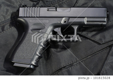Police hand gun on black uniform 101615028