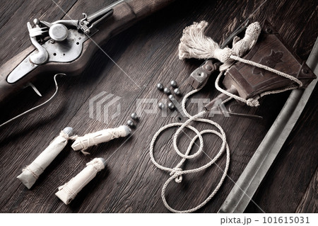 Ancient flintlock musket with powder flask and led bullets. Ancient flintlock musket with powder flask and led bullets. 101615031