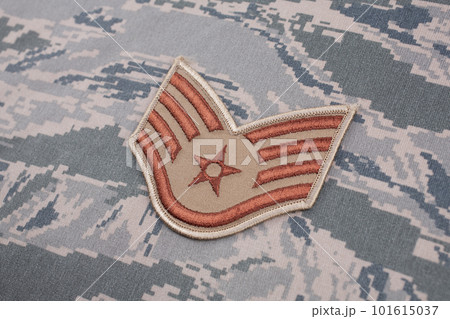 August 31, 2020. US AIR FORCE Staff Sergeant rank patch on digital tiger-stripe pattern Airman Battle Uniform (ABU) background 101615037