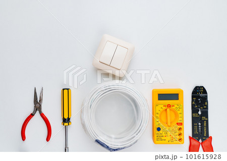 Stripper, Pliers, Multimeter, Wire, switch and Screwdriver on a white background 101615928